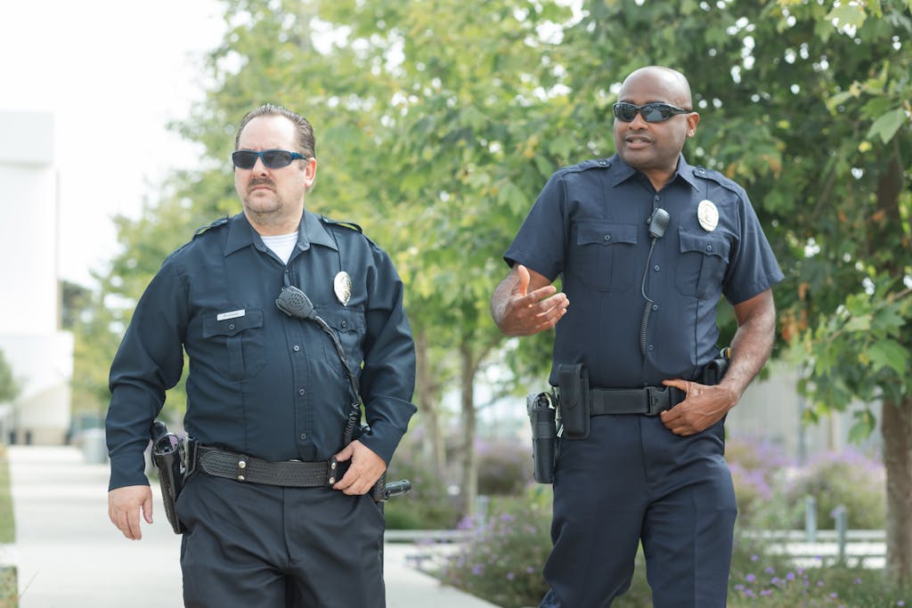 Policemen Walking on the Street
