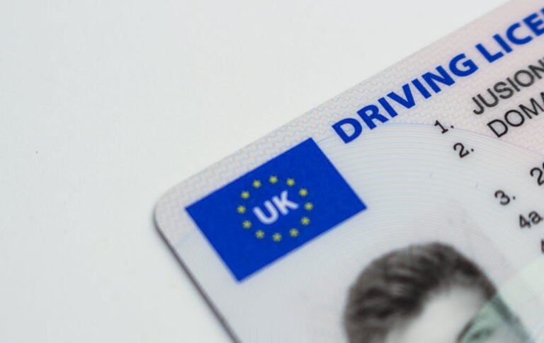 Detailed photo of a UK driving license showcasing EU flag and identity features