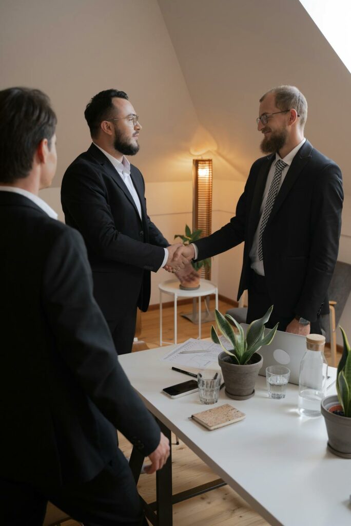 Businessmen Looking at Each Other while Having a Deal