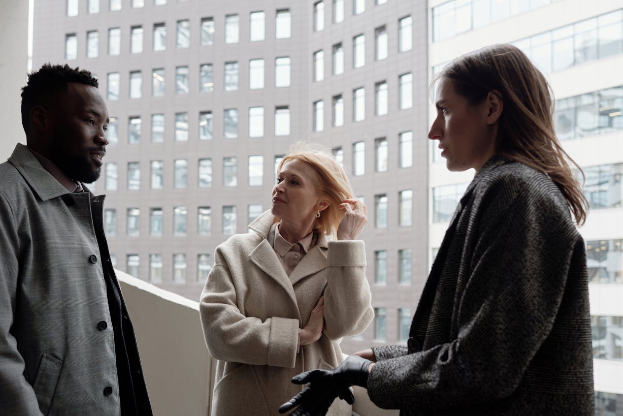 Three Coworkers Talking Outside