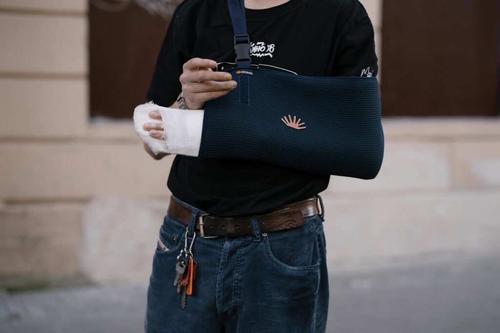 Person with Blue Bandage on his Injured Arm