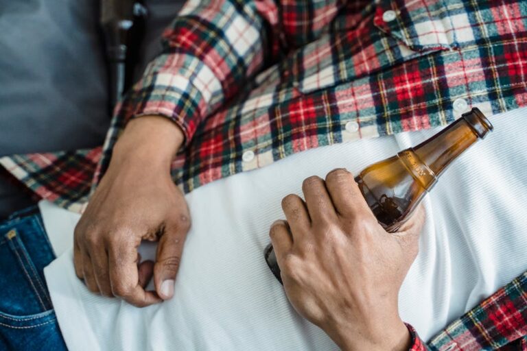 Man Lying Down with Bottle